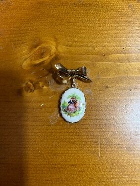 Vintage Bow Pendant with Painted Porcelain Cameo - Gold Tone